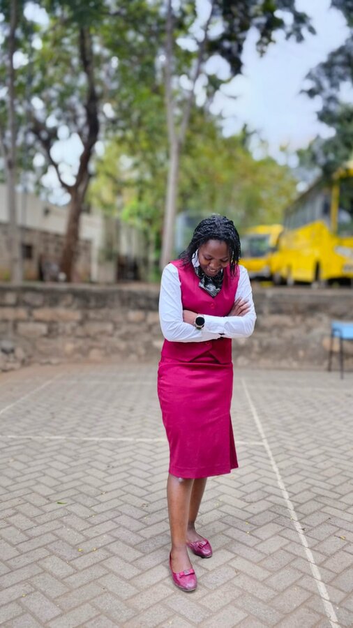 Founder Victoria Wakoli at a school courtyard